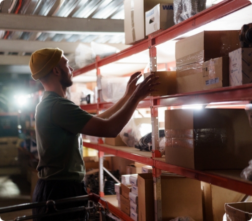 Worker stacking shelves